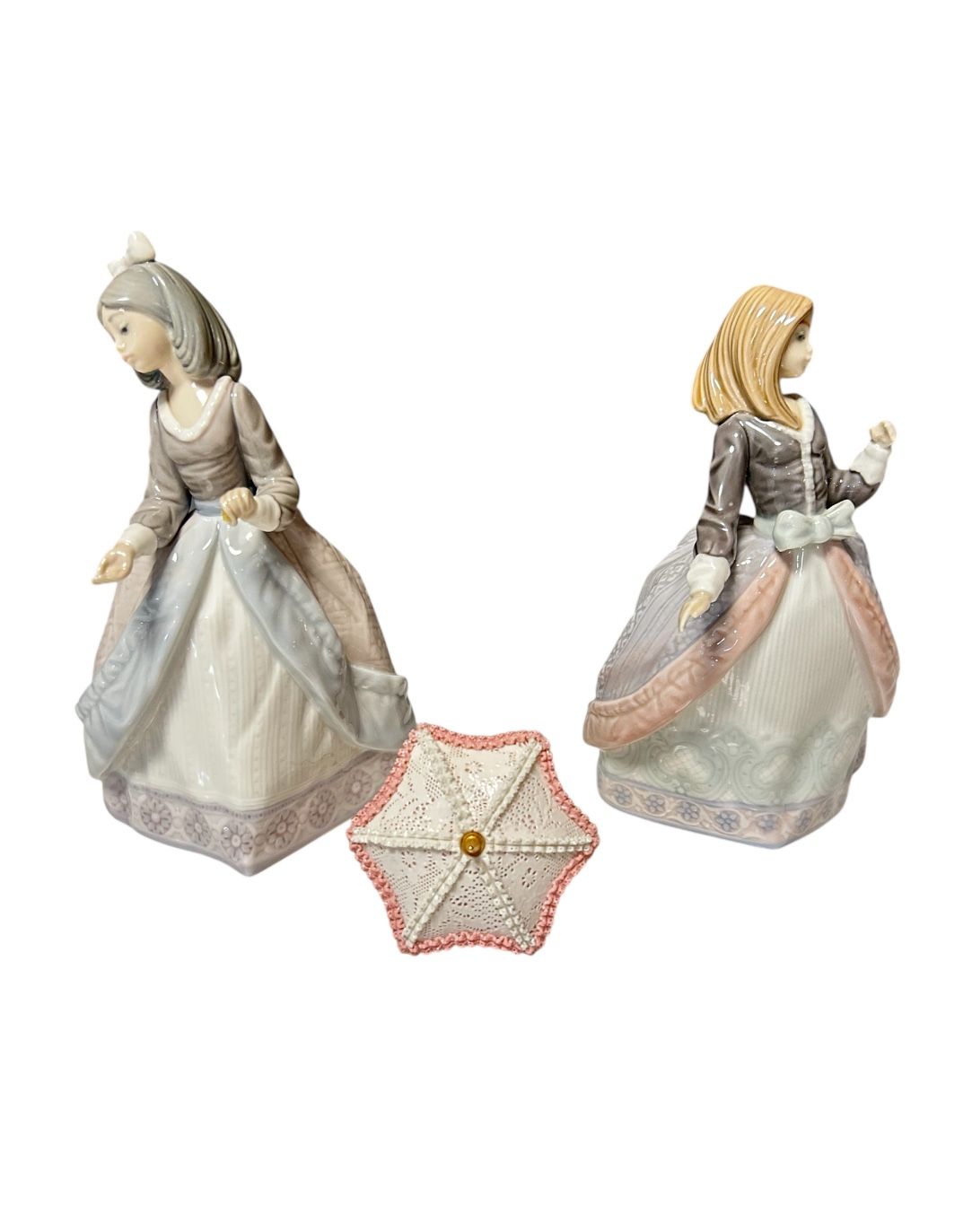 A Bundle Set Of Two Lladros One Has A Broken Hand And The Other One The Umbrella Is Not Intact 