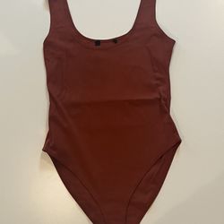 Dark Burnt Orange Body Suit.