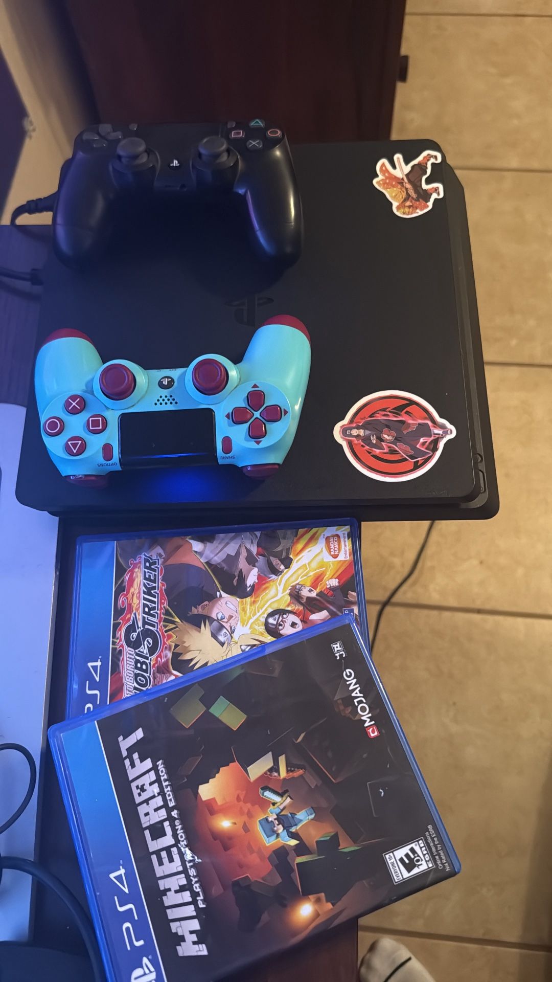 PS4 Slim with 2 controllers and 2 games