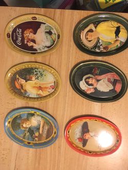 Vintage Coca Cola trays small and large. Also vintage Coca Cola small mirrors (MIRRORS ARE SOLD)