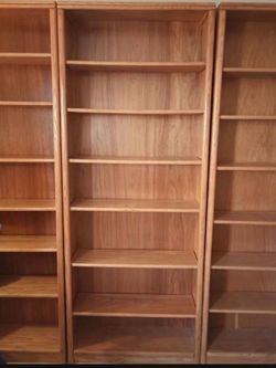 Three beautiful SOLID OAK BOOK CASES with adjustable shelving.