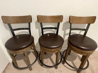 3 bar stools from Ashley Furniture