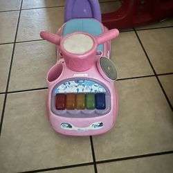 Pink and Purple Ride-On Toy