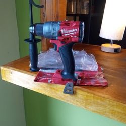 Milwaukee.  18 V New Fuel.  Hammer Drill.  2 Speed.  1/2".  Brushless. W/. Handle 