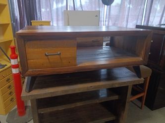 Check out this antique coffee table made with all wood is really strong it will hold any weight