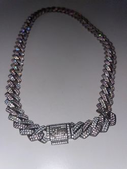 Heavy iced Cuban-link  DRIP necklace with a large DRIP logo clasp