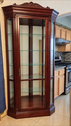 Tall Mahogany Corner Curio Cabinet – Carved Crest Top – OBO