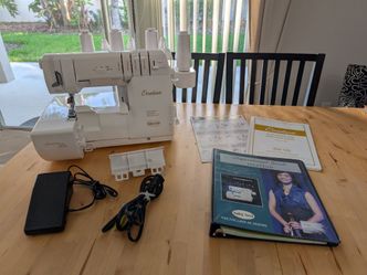 Babylock Ovation with trolley and inspiration book