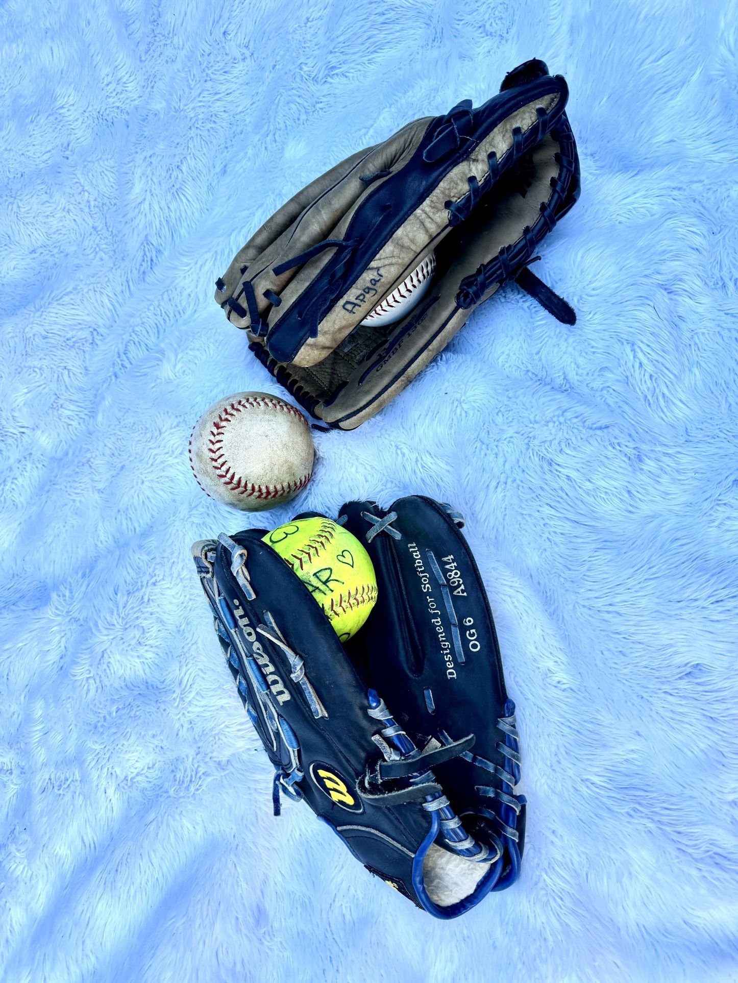 Two softball Gloves With 3 Balls
