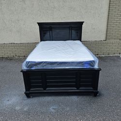 Black Full-size Hilton solid wood bed frame with brand new full-size plush mattress and box spring in  plastics