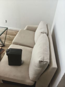 2 Couchs and a end table with 3 design pictures