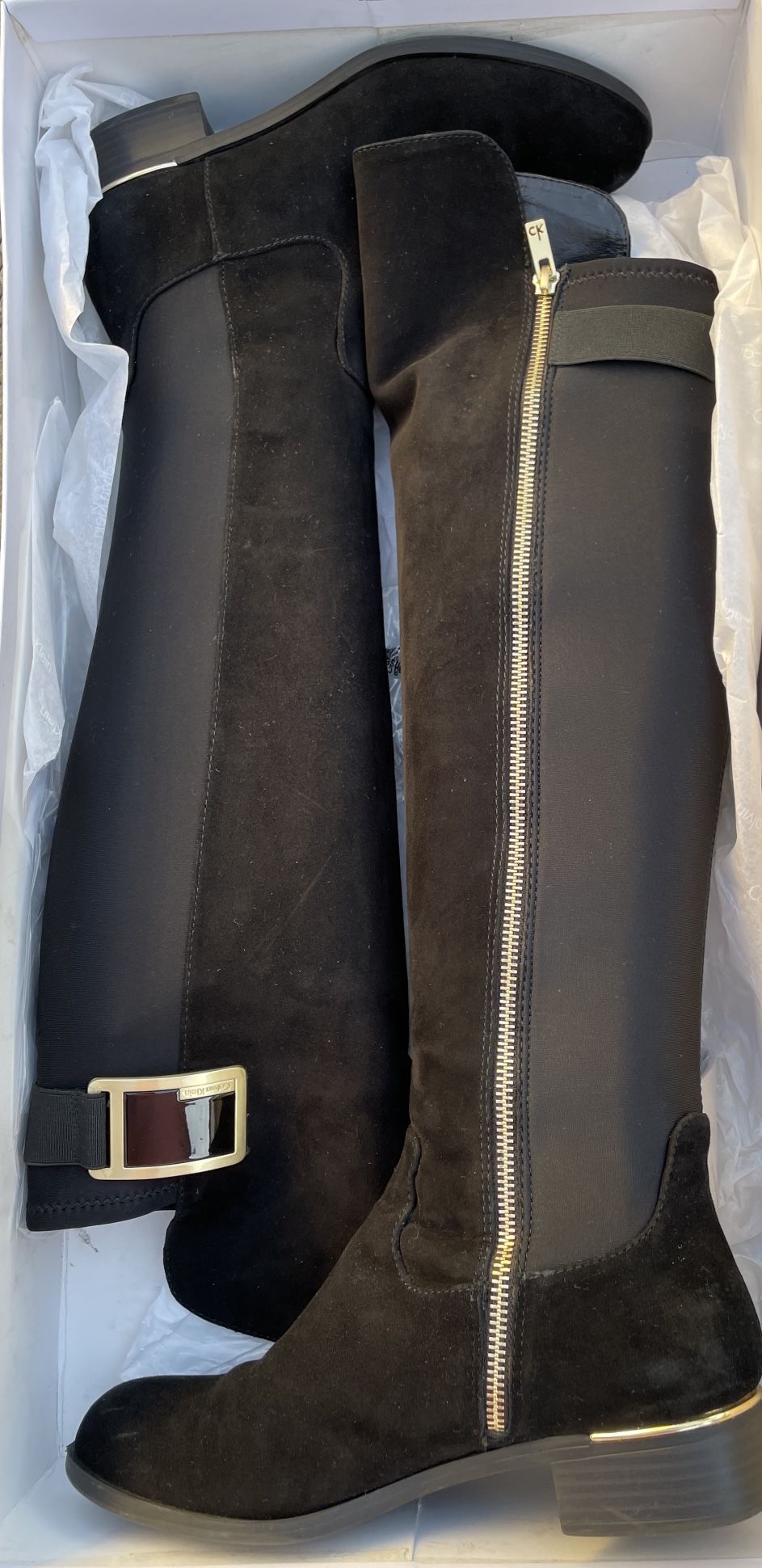 black knee-high suede Calvin Klein boots with beautiful gold detailing