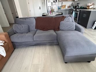 Gray L-Shaped Couch with Reversible Storage