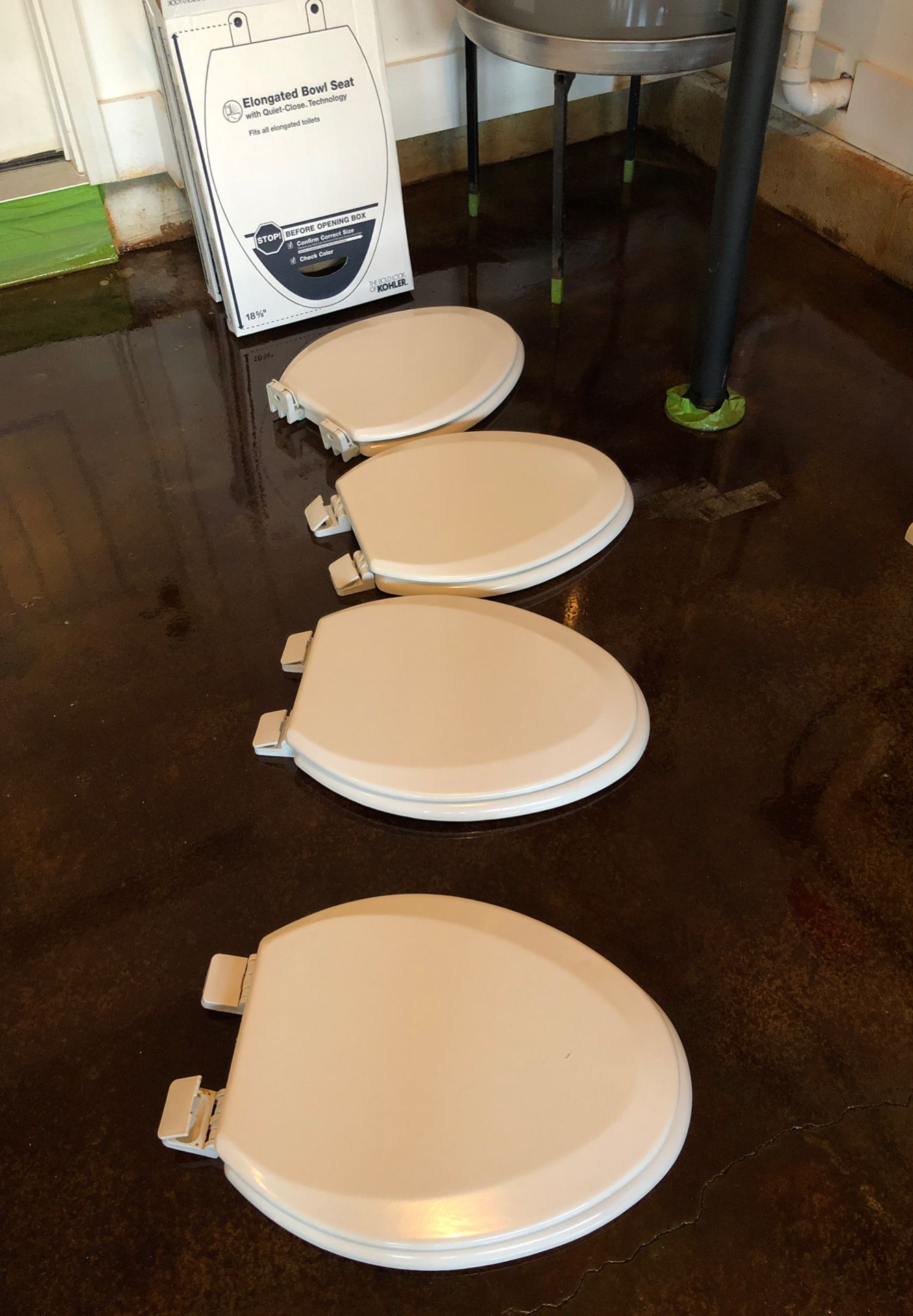 4 white elongated toilet bowl seats