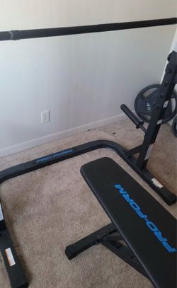 ProForm weight bench and Olympic weights and bar