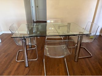 Plexiglass dining table and  four chairs