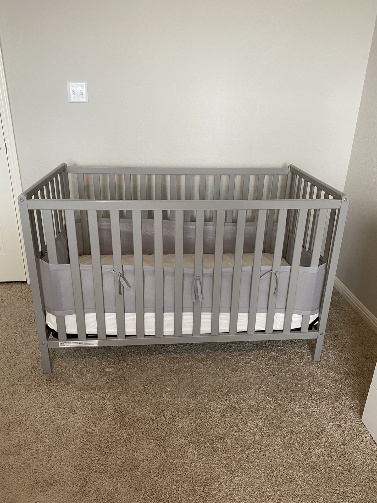 Gray baby crib