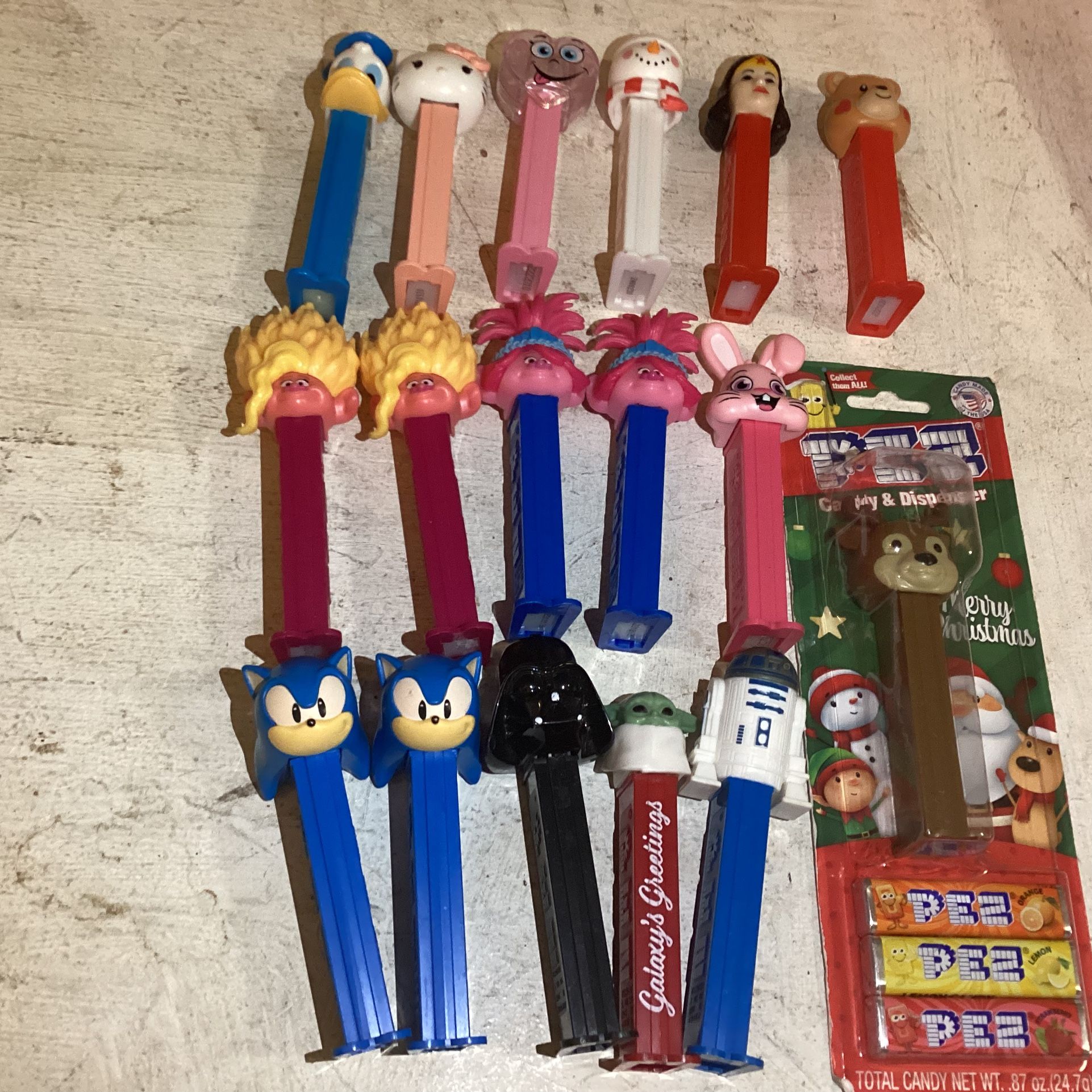 17 Boxed and Loose Pez Dispensers with Wonder Woman disney star wars and more. Trolls Wonder Woman Snowman Heart Bunny Reindeer Bear Donald Duck