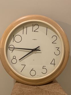 Howard Miller solid wood 25” wall clock NOS