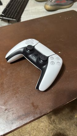 White ps5 controller (charger included)