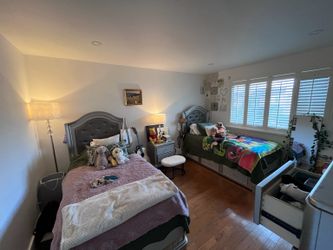 Two Matching Gray Twin Storage Beds with Drawers