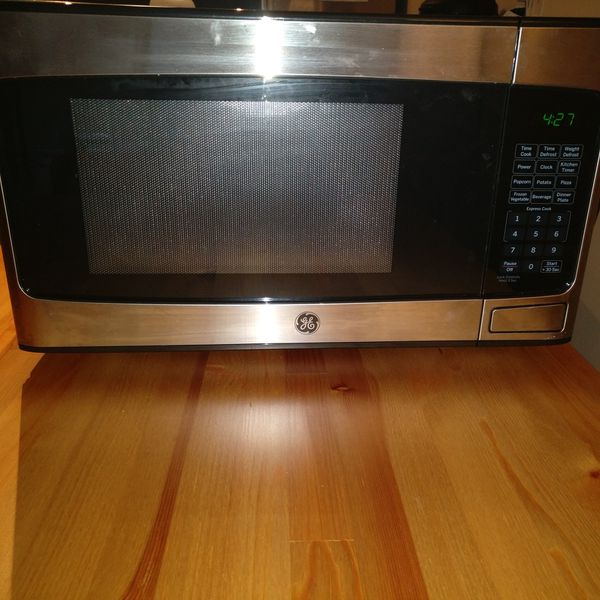 GE - 1.1 Cu. Ft. Mid-Size Microwave - Stainless steel for Sale in