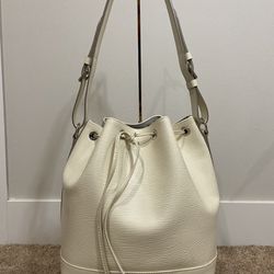 Authentic LOUIS VUITTON Epi Petit Noe NM Ivory for Sale in