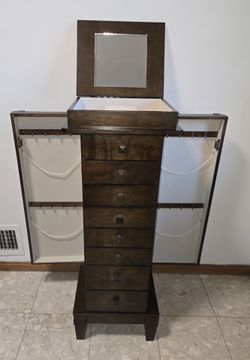Jewelry Armoire with mirror in excellent condition