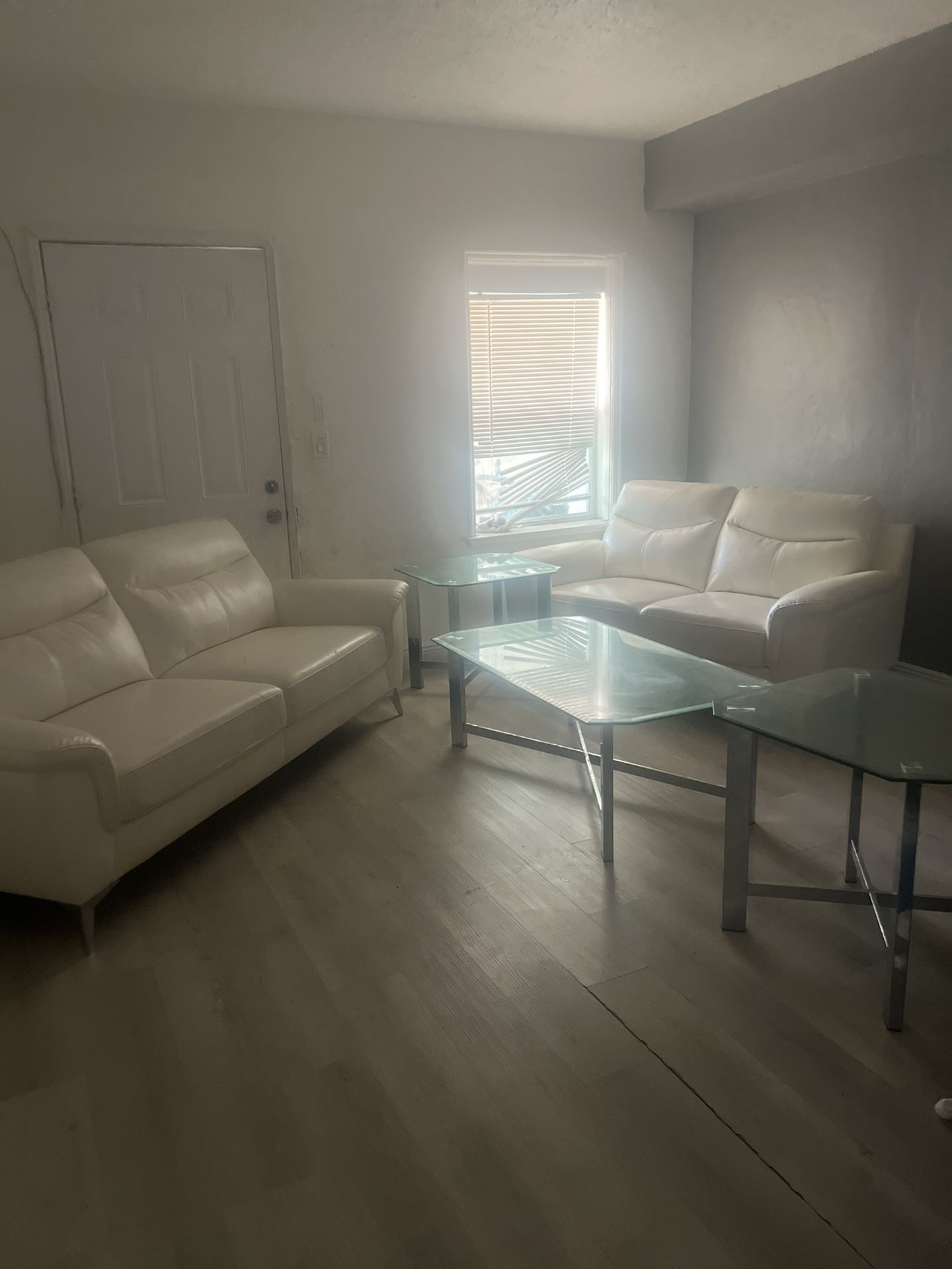 White Couch With Glass Table 