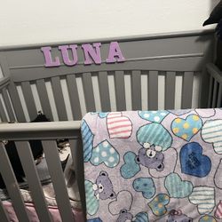  A bag full of 6 to 9 month old boy, clothes, and great condition and a crib with mattress