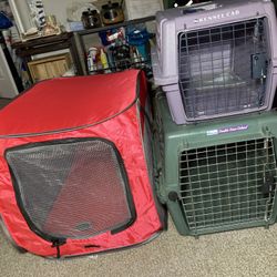 2 Pet Kennels  purple ones a little bit smaller, green one has a second door on the top that opens up, they can Come Apart To Store