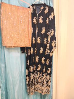 Salwar kameez is a traditional, versatile South Asian outfit consisting of a tunic (kameez), trous