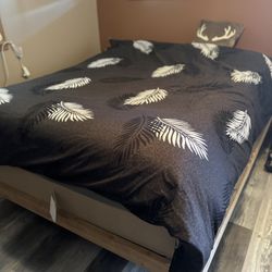 Custom-made wooden floating bed frame (fits a queen mattress – mattress not included).