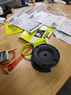 Ryobi Reel Easy And Bump Feed Strings Head With Speed Winder New Broken Bag $12 Or Best Offer