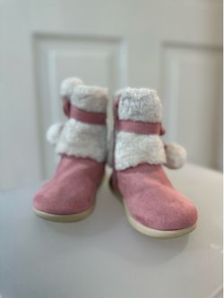 Pink white faux fur boots with pom-poms and bow