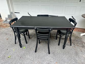 Black solid wood dining table and chairs
