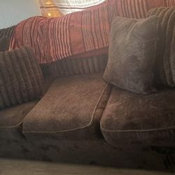 brown couch and love seat