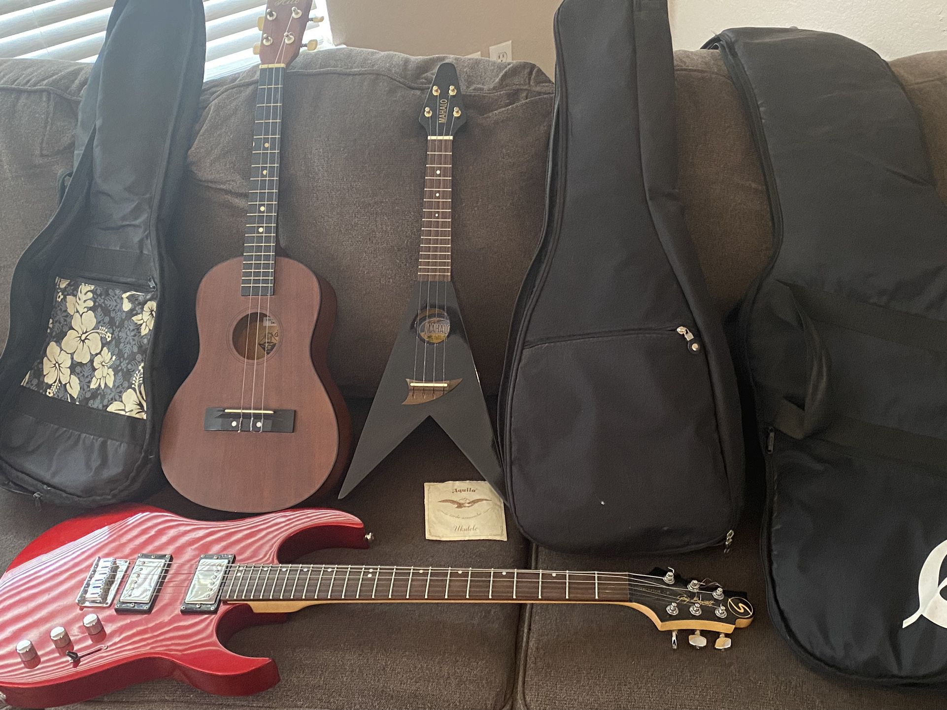 1 Electric Guitar And 2 Ukulele $200