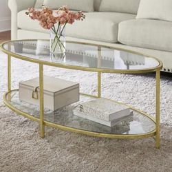 Bella 46 in. Gold Leaf/Clear Large Oval Glass Coffee Table with Shelf