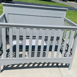 Delta Children Fancy 4-in-1 Convertible Crib in gray. This crib was brand new in the box, never used. I assembled it for the photos. 