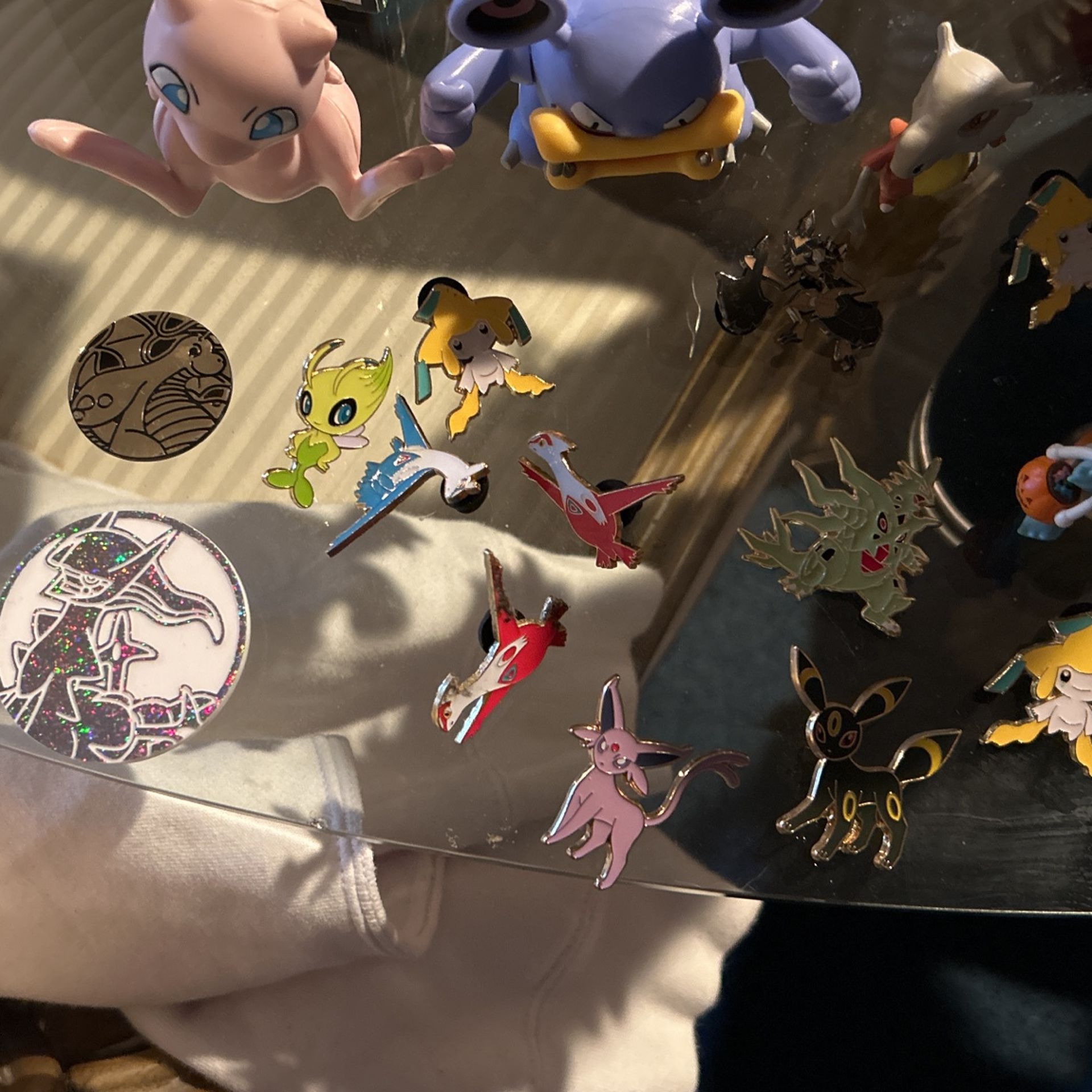Pokémon lot of pins and coins and action figures