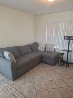 Gray sectional sofa in excellent condition
