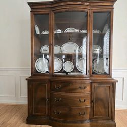 Wooden China Hutch Cabinet with Glass Doors and White Floral China Dinnerware Set. In excellent condition front and back! Serious inquiries only.

Eas