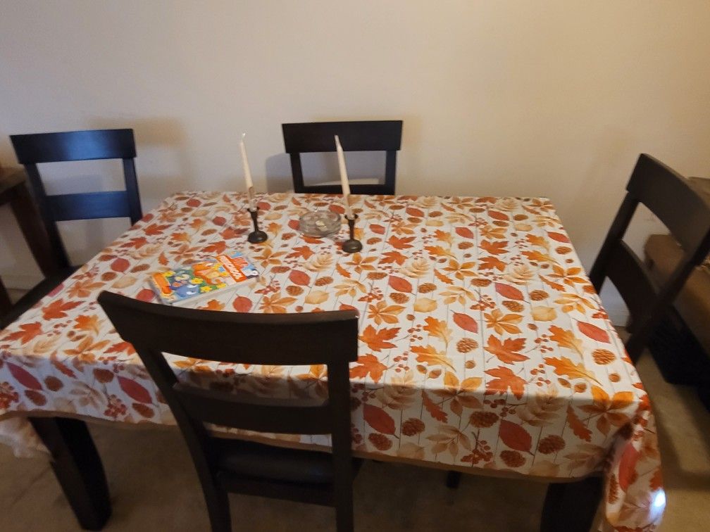 Dining Table and 4 cushioned chairs, Brown ,Good Condition