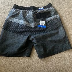 Brand new Kirkland Men’s swim shirt size L