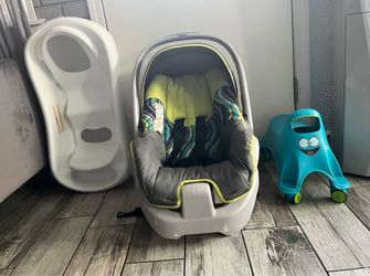 Selling baby items: baby tub, car seat, & toy rider