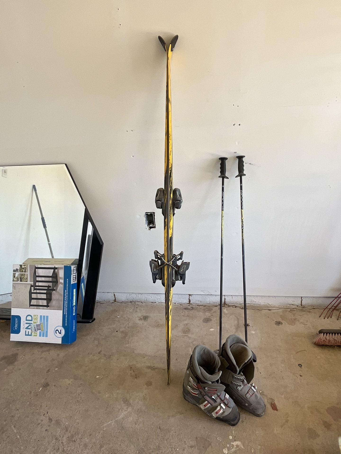 downhill skiis, and poles and boots 