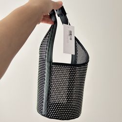 Reformation bucket bag.