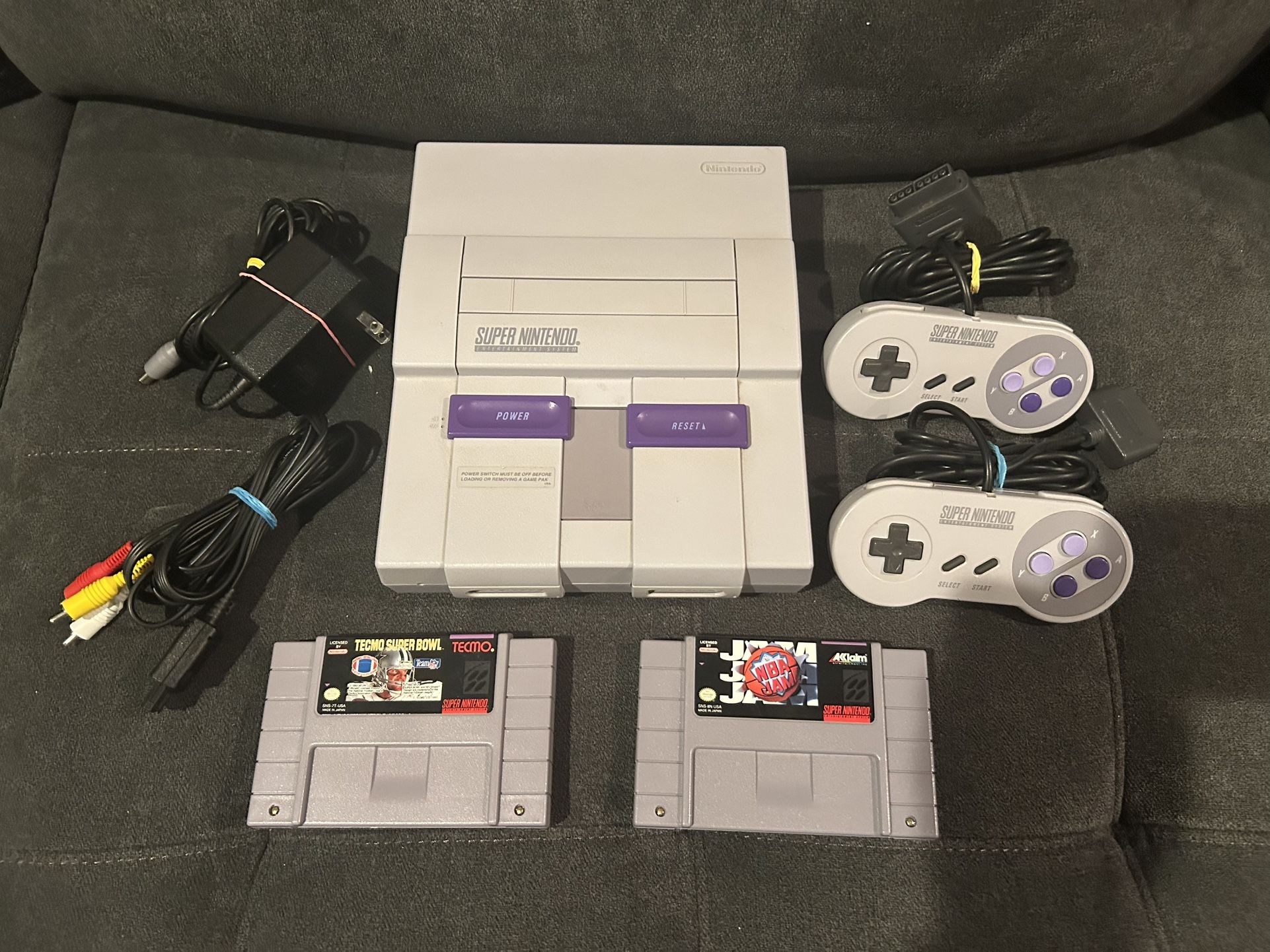 Super Nintendo With Two Games, Two Controllers, Power And Video Cables
