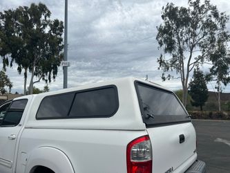 White camper shell for 2004 Toyota Tundra extended cab